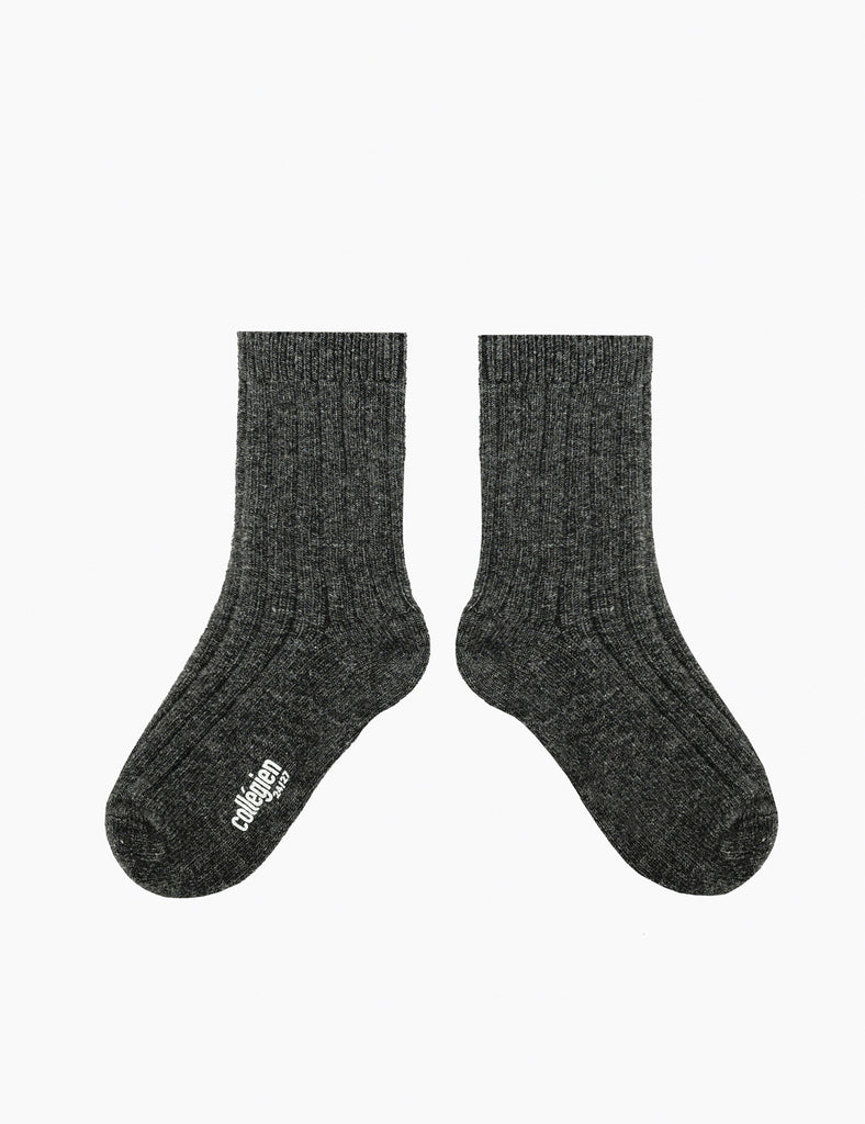 Pair of dark gray socks with a brand logo on a white background