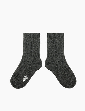 Pair of dark gray socks with a brand logo on a white background