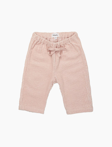 Pink baby pants with a bow on a white background