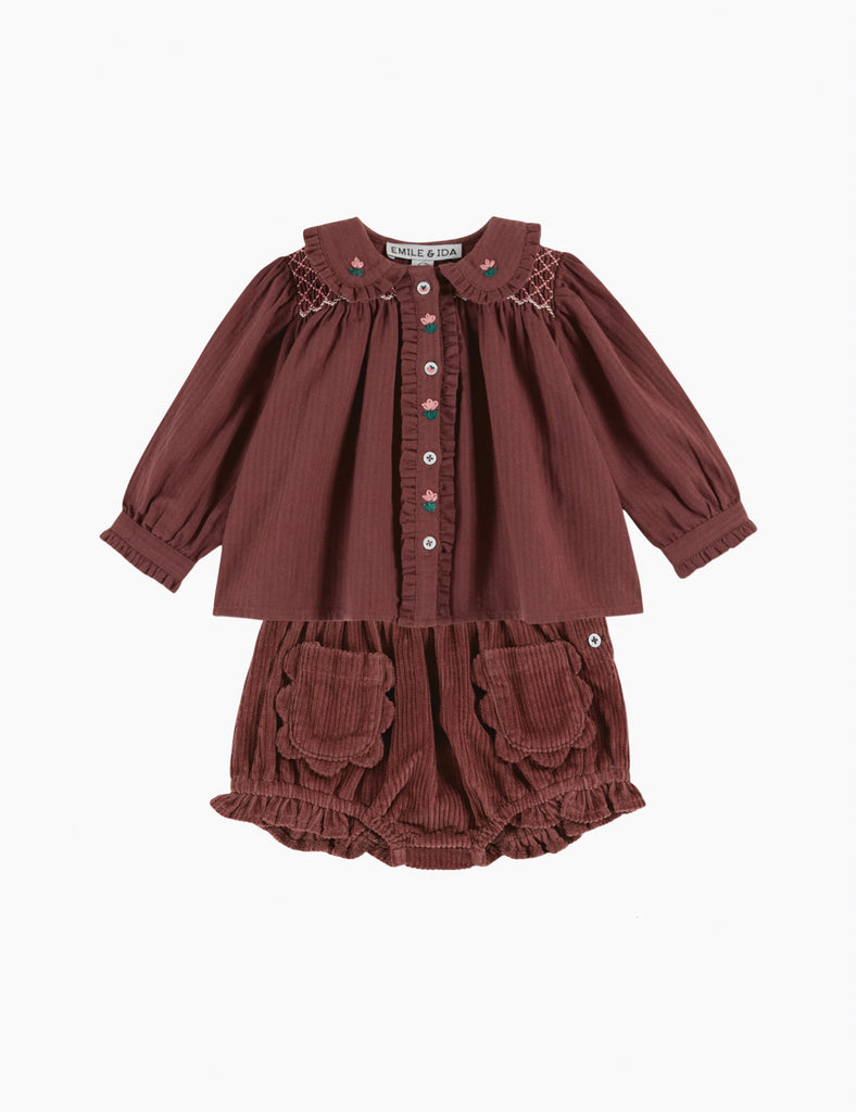 Brown children's outfit with a blouse and bloomers on a white background