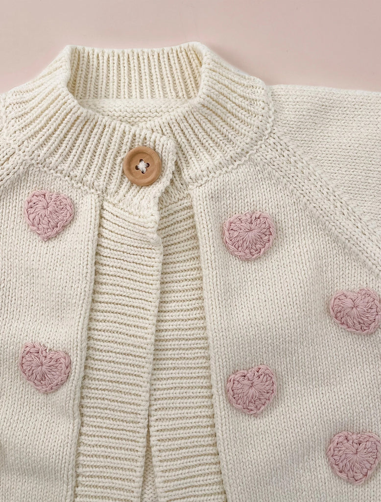 Cotton Heart Cardigan in Cream flat lay image.