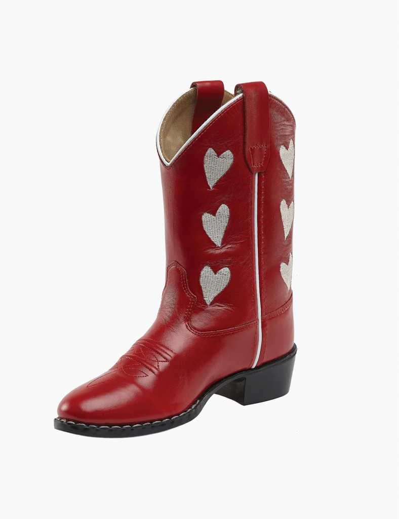 Red cowboy boot with white heart patterns on a white background