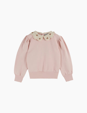 Pink sweater with a decorative collar on a white background