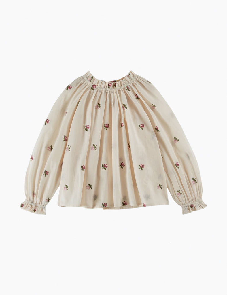 Beige blouse with floral patterns on a white background