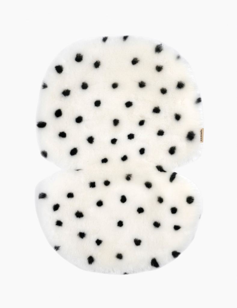 White buggy liner with black polka dots on a white background