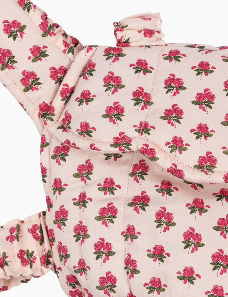 Floral patterned fabric with pink flowers on a white background