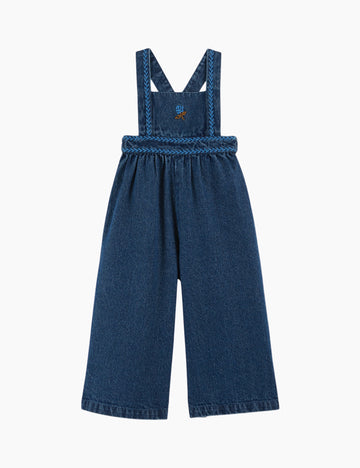 Blue denim overalls on a white background