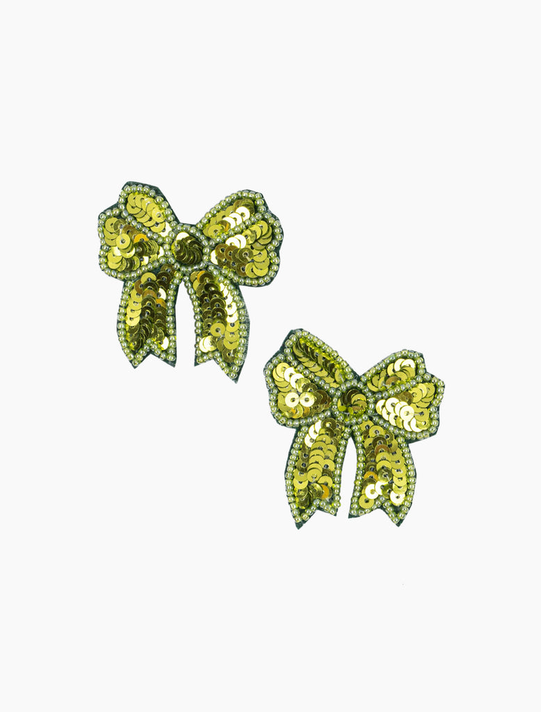 Pair of green sequin bow earrings on a white background