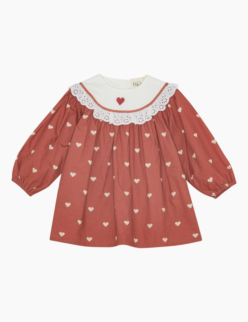 Red dress with heart patterns on a white background