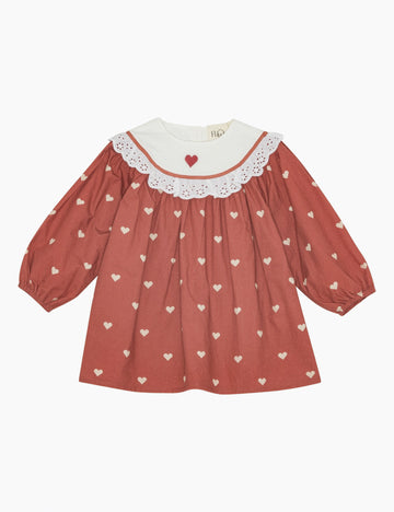 Red dress with heart patterns on a white background