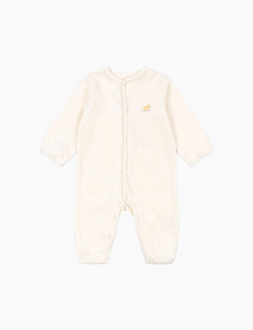 Cream-colored baby onesie on a white background
