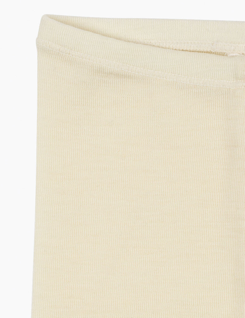 Cream wool leggings on a white background