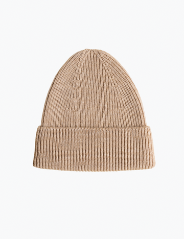 Beige knit beanie on a white background
