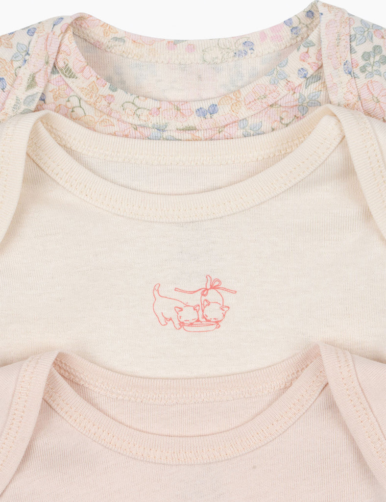Close-up of 3-pack baby bodysuits on a white background.