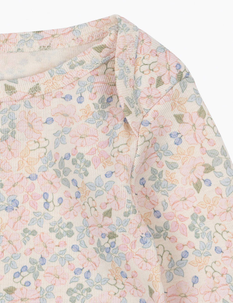 Floral patterned fabric with pastel colors on a white background
