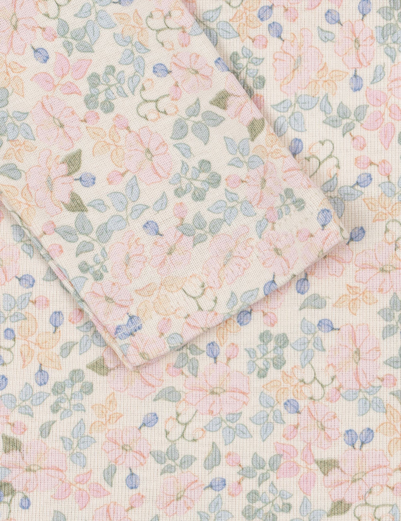 Floral patterned fabric with pastel colors on a light background