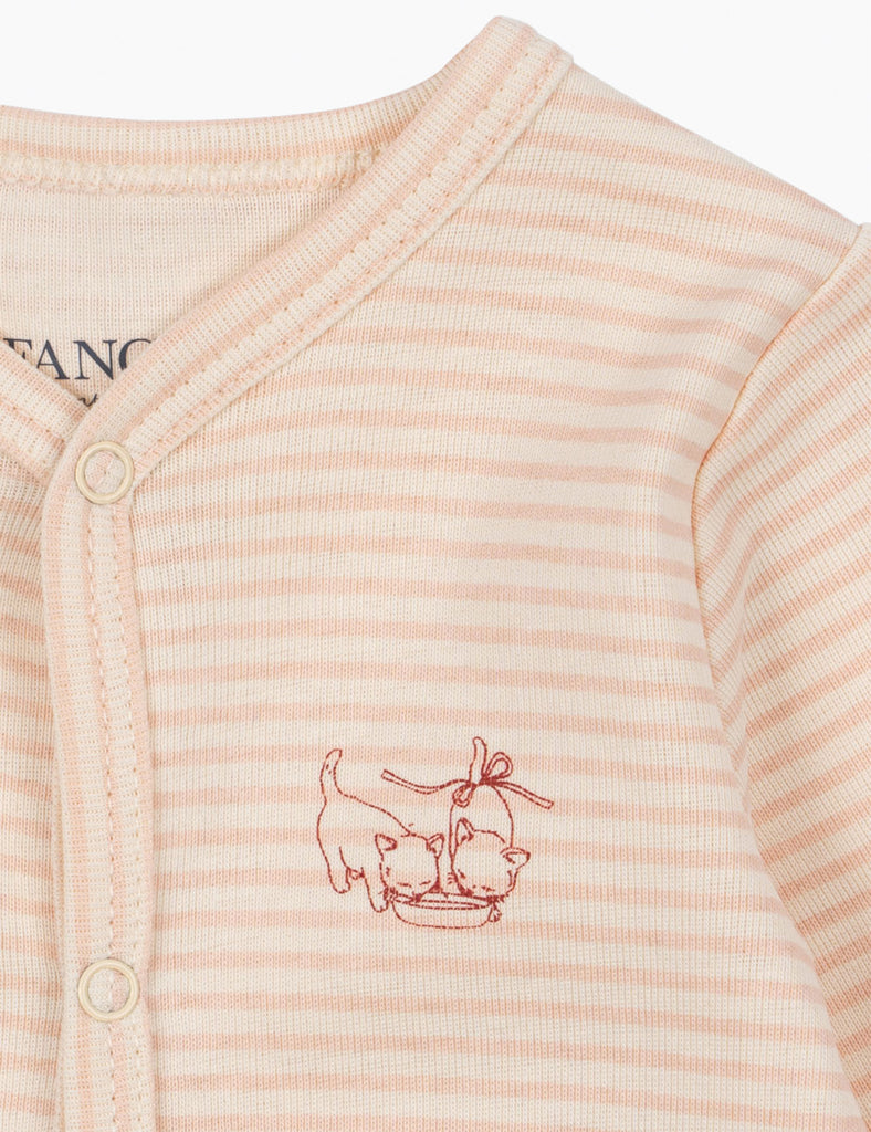 Close-up of a baby outfit with striped pattern and kitten design on a white background