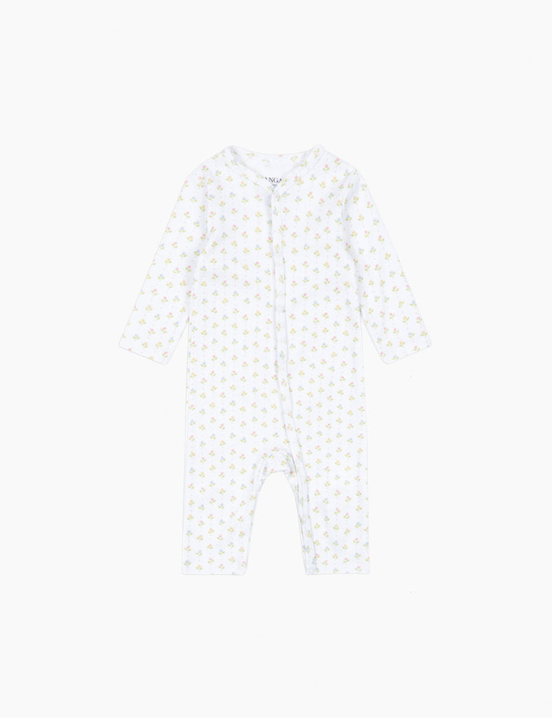 White baby onesie with small tulip patterns on a white background