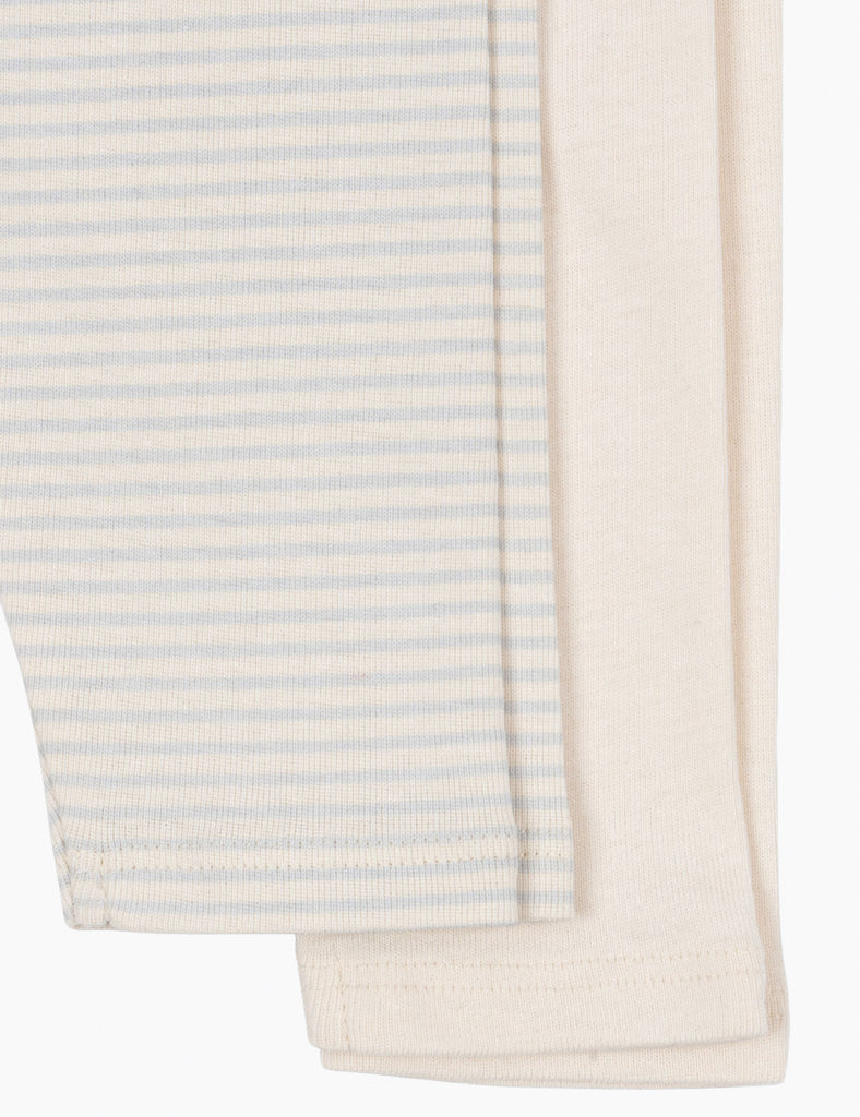 Close-up of striped fabric with a neutral color palette on a white background