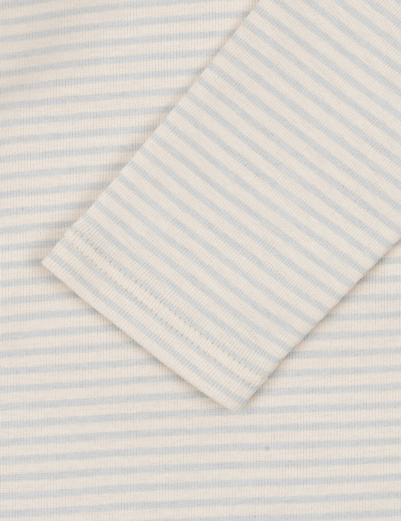 Folded fabric with light blue and white stripes on a matching background