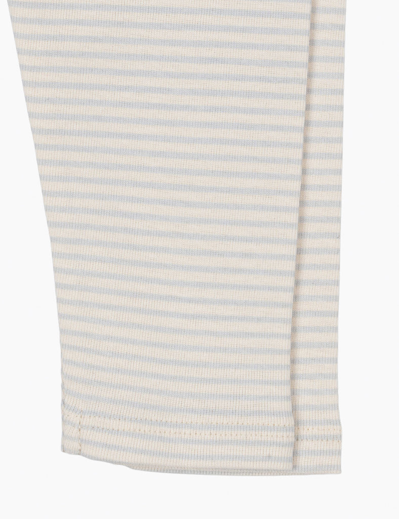 Close-up of a white and light blue striped fabric on a white background