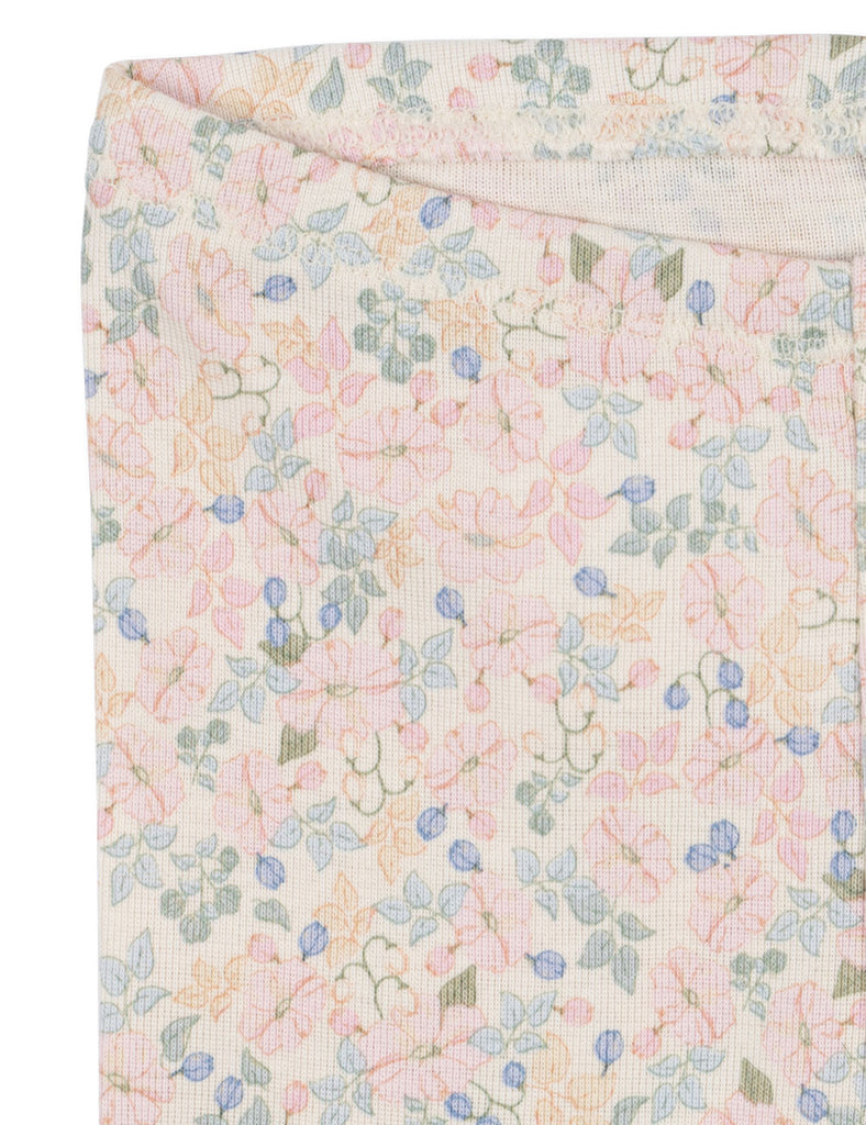 Floral patterned fabric with small flowers and leaves on a light background