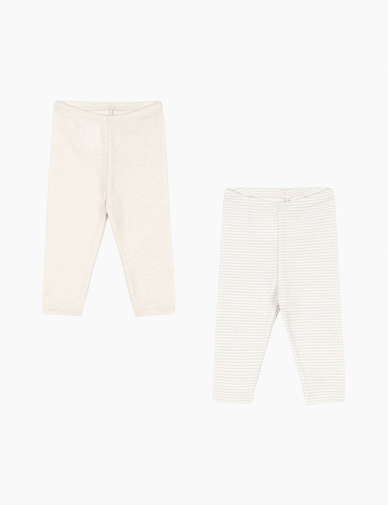 Two pairs of baby leggings, one plain white and one with a subtle pattern, on a white background.