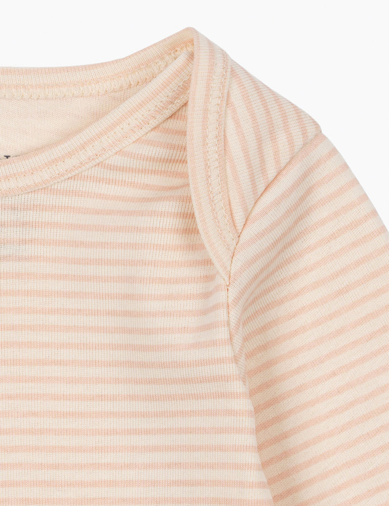 Close-up of a beige and white striped long-sleeve shirt on a white background