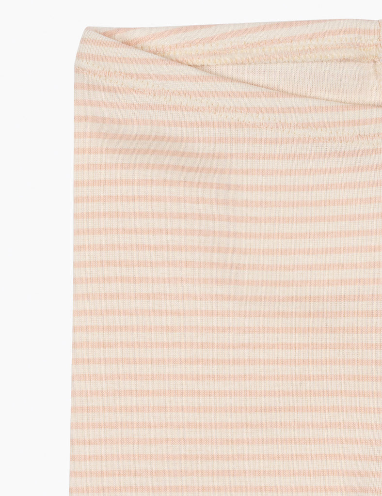 Close-up of a fabric with thin pink stripes on a white background