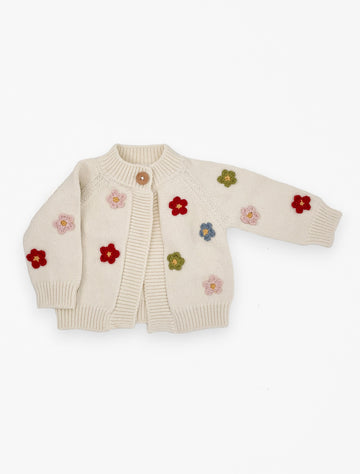 Flat image of the flower cardigan with multi colored knit flowers in cream.