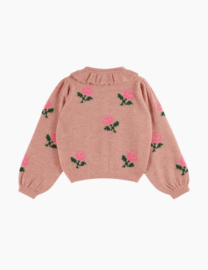 Pink sweater with floral patterns on a white background