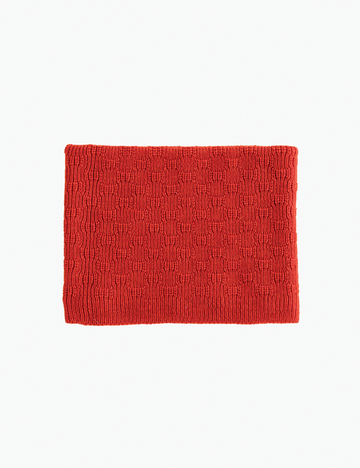 Red knitted tube scarf on a white background