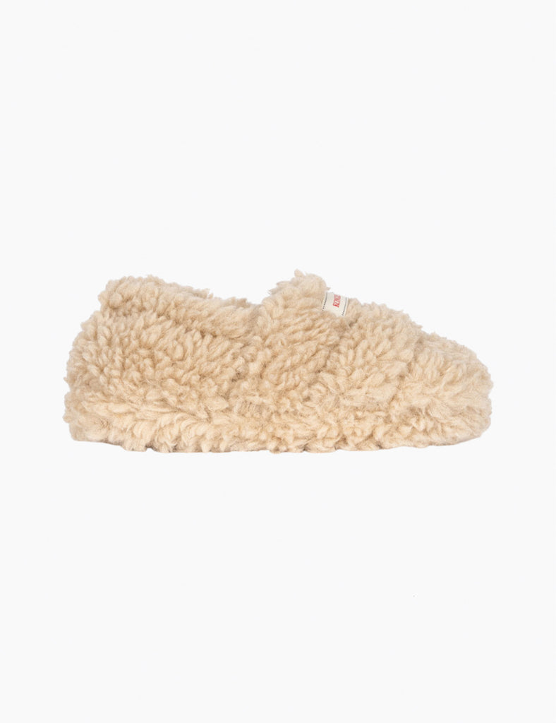 Beige slipper on a white background