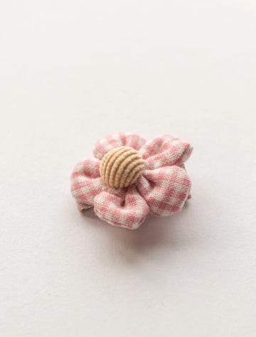 Image of a gingham flower clip for babies, toddlers and big kids with fine hair. 