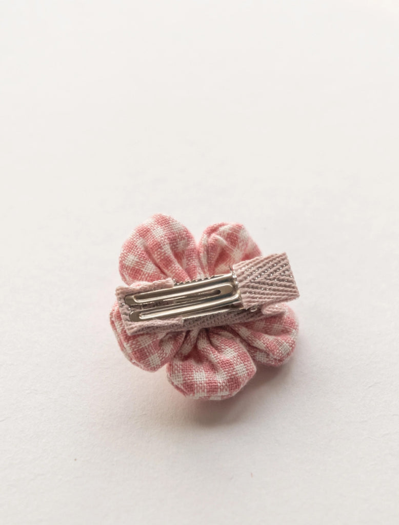 Image of the back of a gingham flower clip for babies, toddlers and big kids with fine hair. 