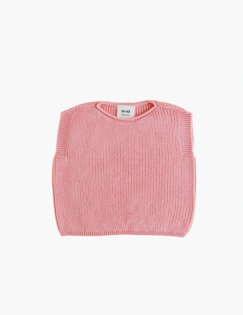 Pink ribbed baby vest on a white background
