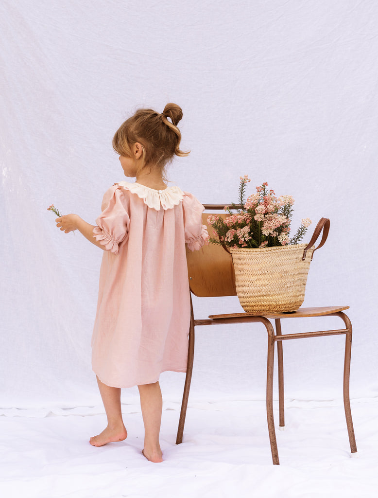 Image of the Hazel Dress in Peach Linen on model.