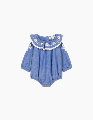 Blue baby romper with floral embroidery on a white background