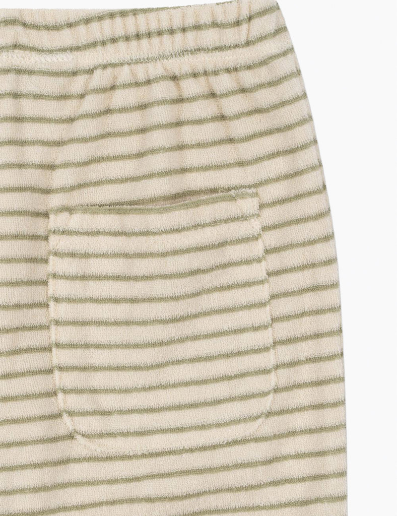 Close-up of a textured fabric with horizontal stripes on a white background