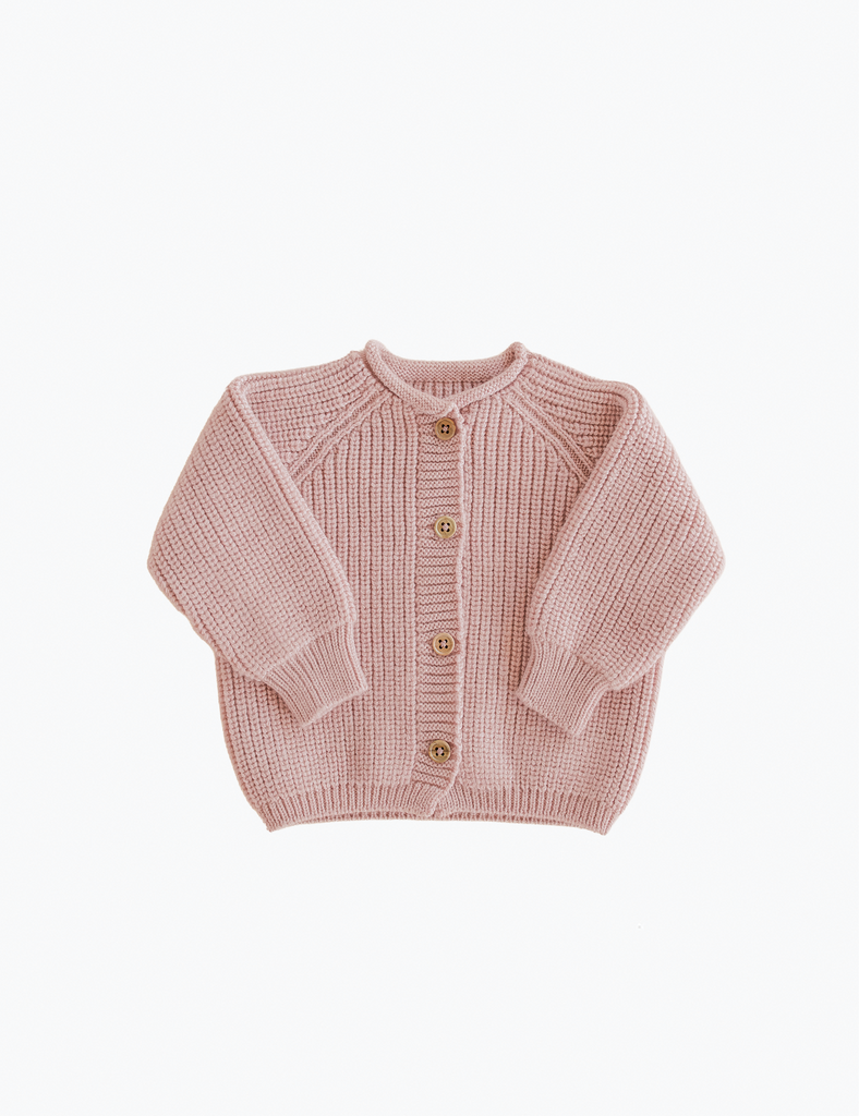 Pink knitted cardigan on a white background