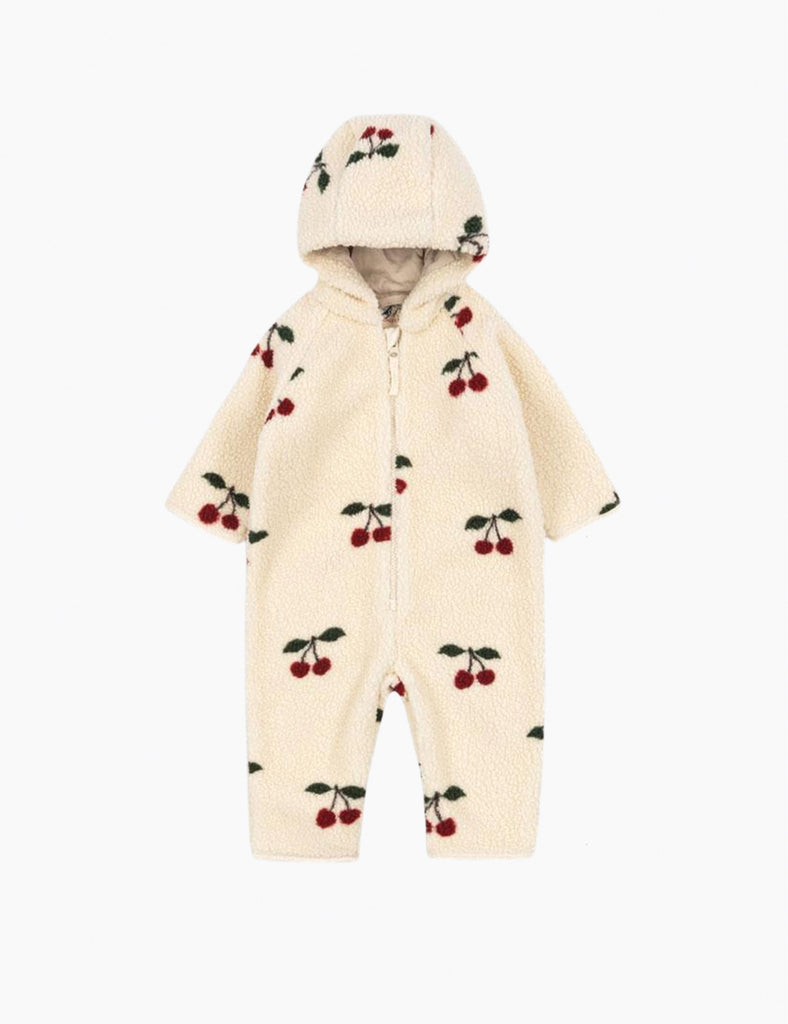 Cream-colored baby romper with cherry pattern on a white background