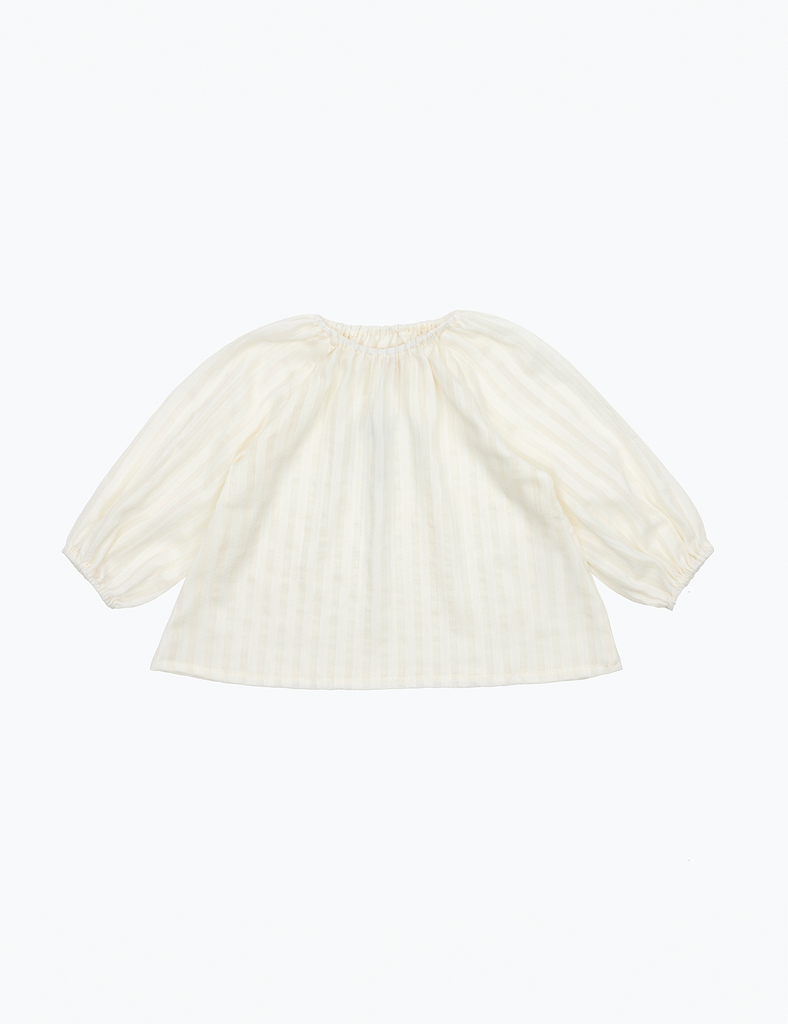 White satin top with puff sleeves on a white background