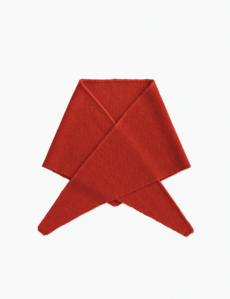 Red knitted headband on a white background