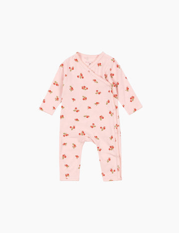 Pink baby onesie with floral pattern on a white background