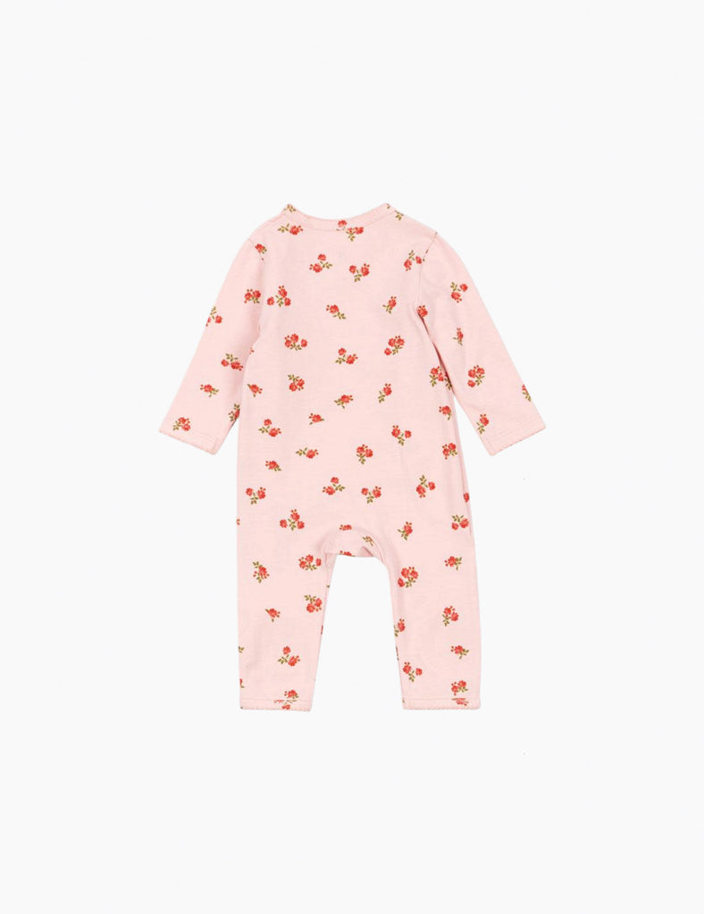 Pink baby onesie with floral pattern on a white background