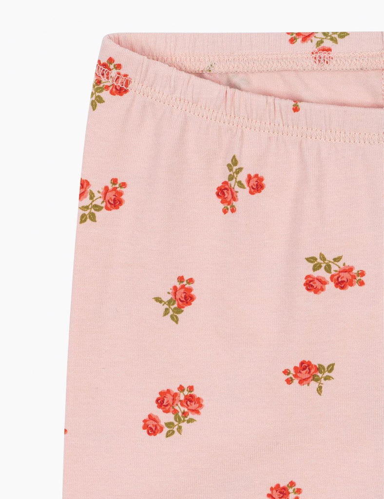 Pink fabric with floral pattern on a white background