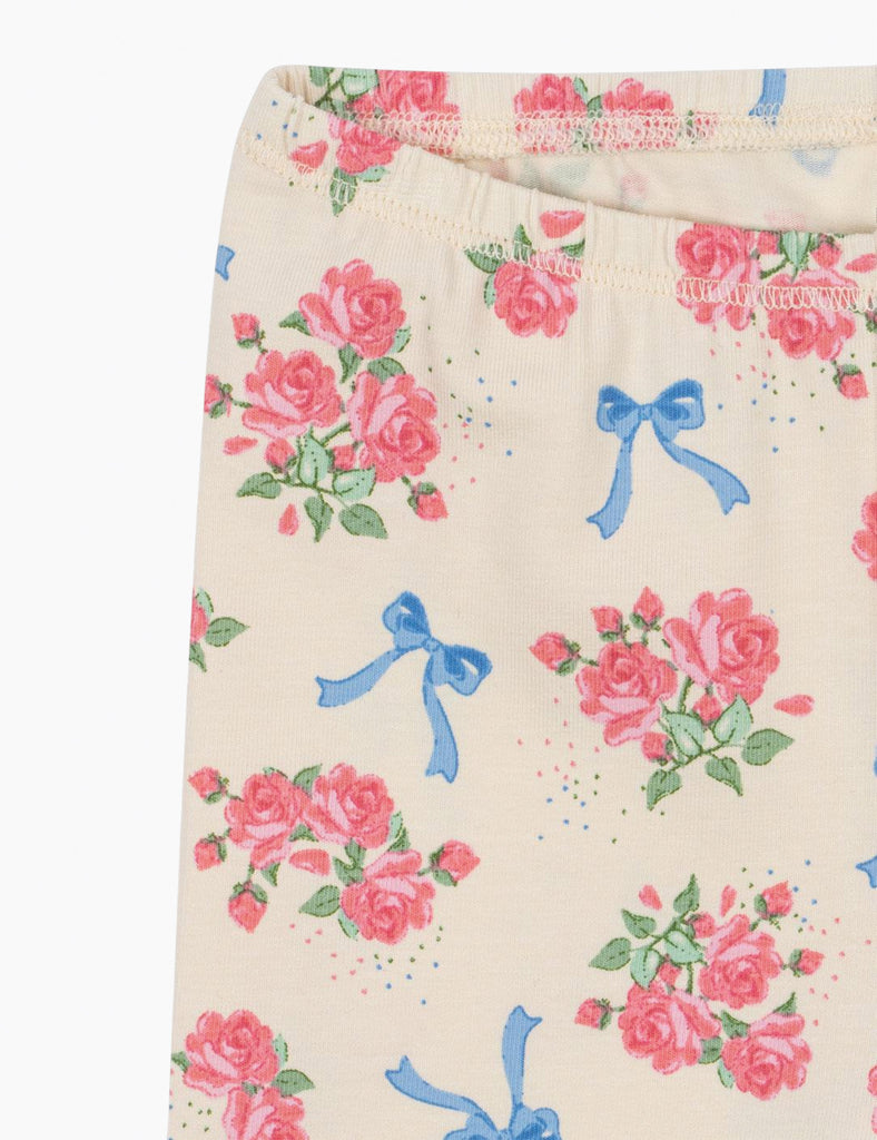 Floral pattern with pink roses and blue bows on a white background