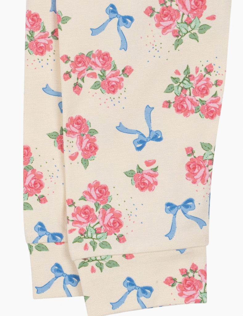 Fabric with floral and bow pattern on a white background
