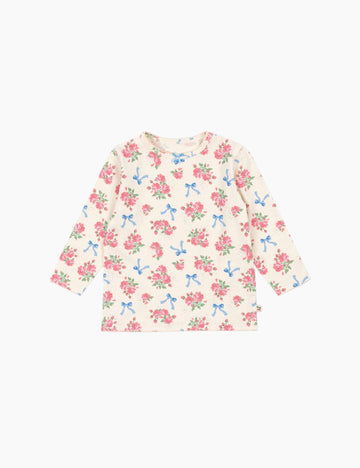 Floral top with bow pattern on a white background