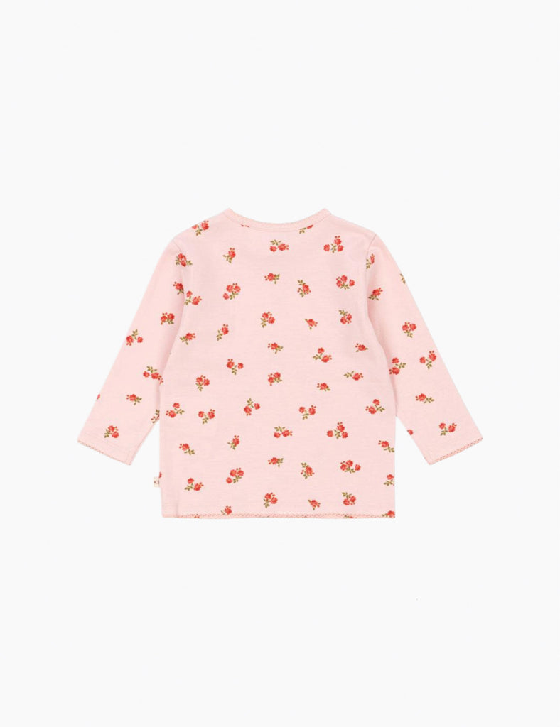 Pink dress with floral pattern on a white background